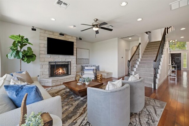 living room featuring visible vents, a fireplace, and recessed lighting