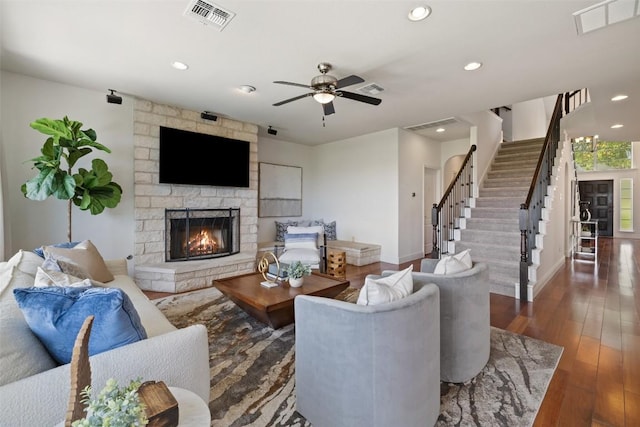 10709 Pointe View Dr, Austin, TX 78738 - living area featuring a stone fireplace, recessed lighting, stairs, wood finished floors, and a ceiling fan
