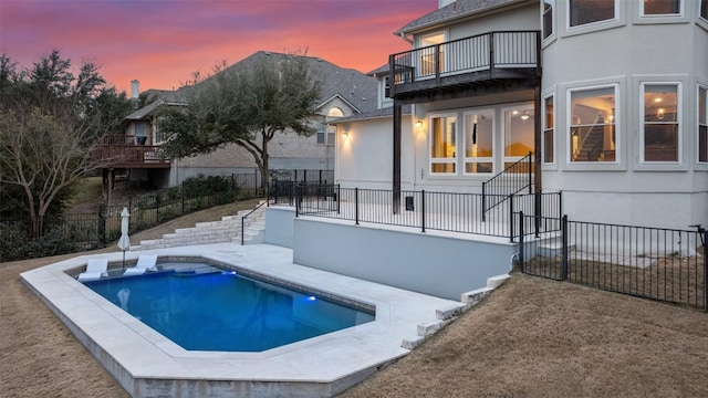 10709 Pointe View Dr, Austin, TX 78738 - pool at dusk featuring stairway and a patio area