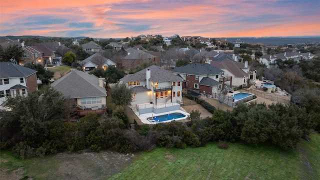 birds eye view of property with a residential view