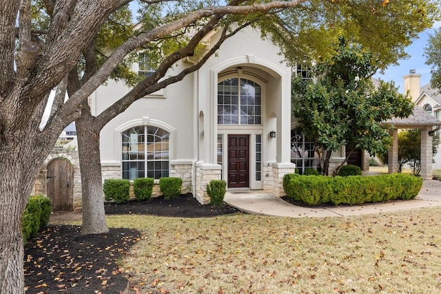 10709 Pointe View Dr, Austin, TX 78738 - entrance to property featuring stone siding, stucco siding, and a chimney