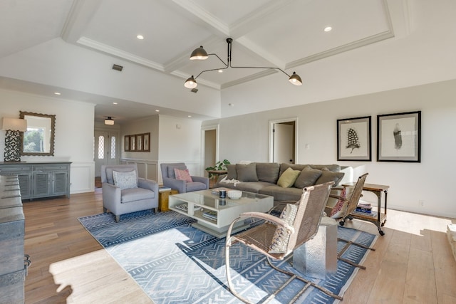 living room with high vaulted ceiling, crown molding, light hardwood / wood-style floors, and beamed ceiling