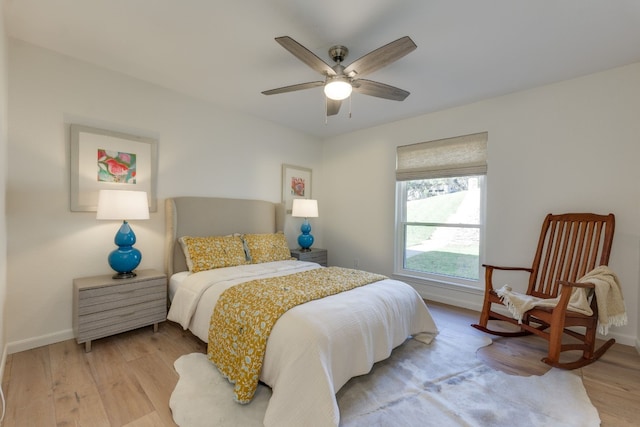 bedroom with ceiling fan and light wood-type flooring