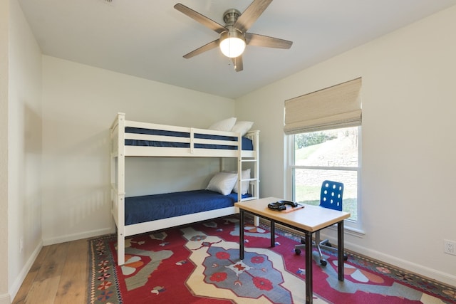 bedroom featuring ceiling fan and wood-type flooring