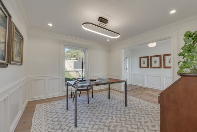 office featuring ornamental molding and light hardwood / wood-style flooring