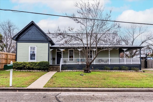 view of front of property with a front yard and a porch