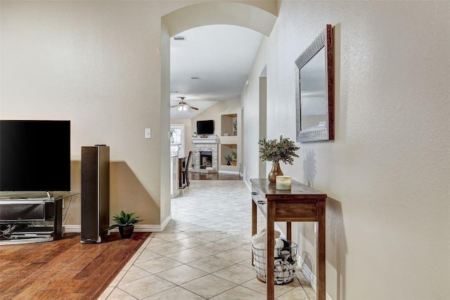 corridor featuring light tile patterned floors