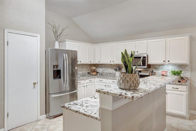 kitchen with stainless steel appliances, a center island, and white cabinets