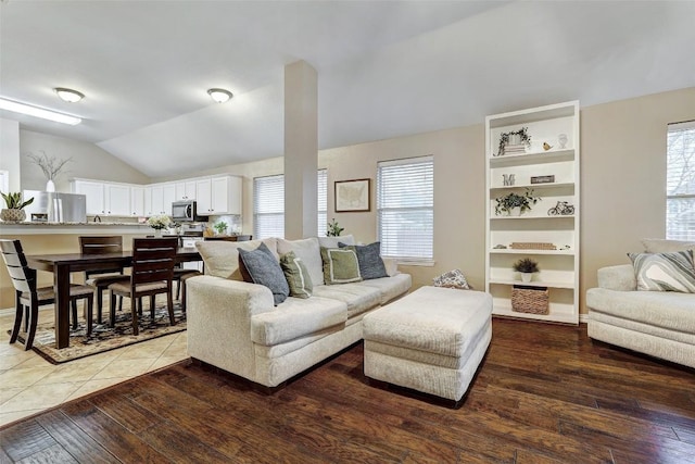 living room with lofted ceiling and hardwood / wood-style floors