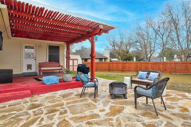 view of patio featuring a pergola and a fire pit