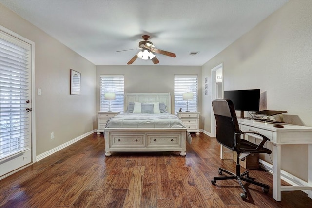 bedroom with dark hardwood / wood-style flooring and ceiling fan