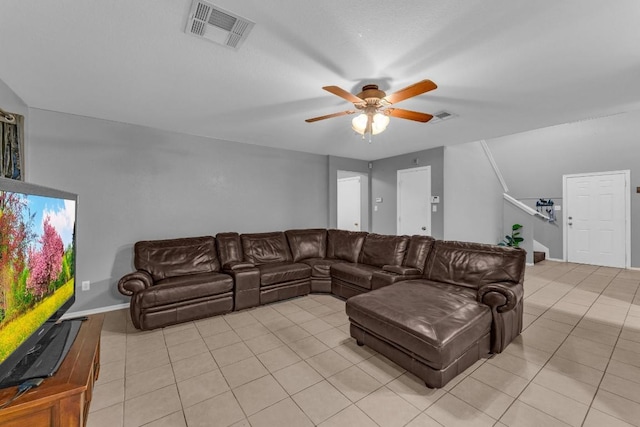 tiled living room with ceiling fan