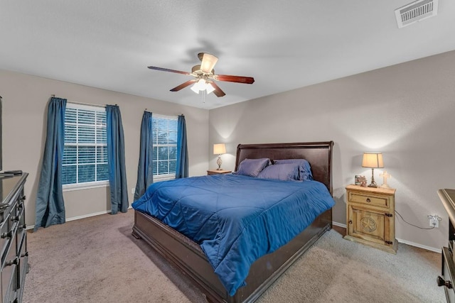 bedroom with light colored carpet and ceiling fan