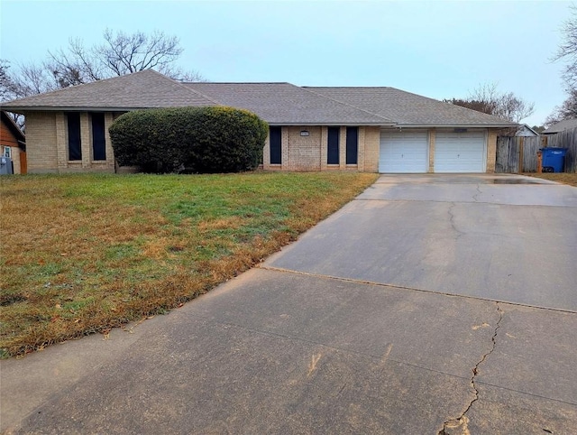 view of front of property with a garage and a front yard