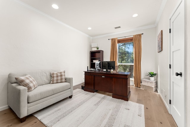 home office with crown molding and light wood-type flooring