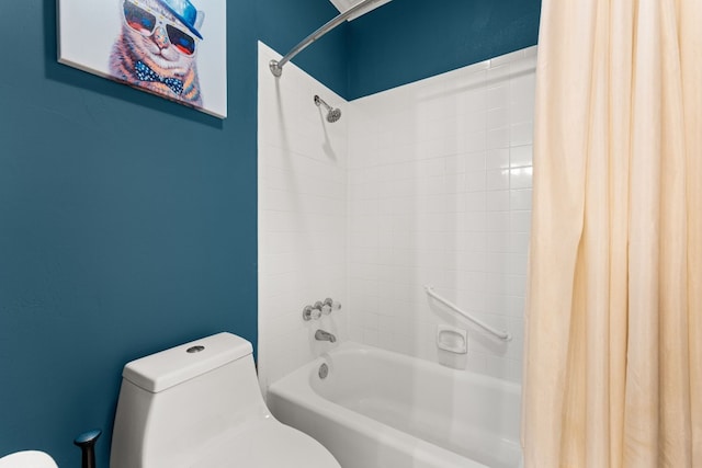 bathroom with shower / bath combination with curtain and toilet