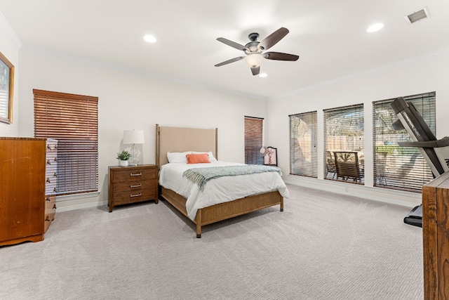 bedroom featuring crown molding, light colored carpet, and ceiling fan