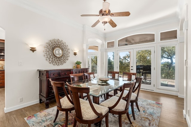 dining area with french doors, ceiling fan, ornamental molding, and hardwood / wood-style floors