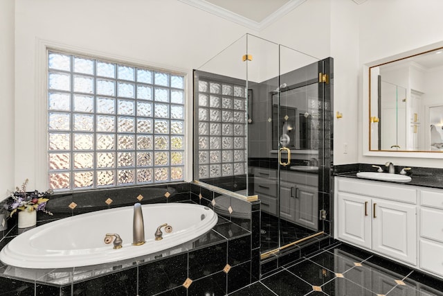 bathroom featuring ornamental molding, independent shower and bath, and vanity