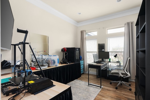 home office featuring crown molding and hardwood / wood-style flooring