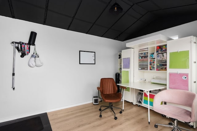 office area featuring vaulted ceiling and light wood-type flooring