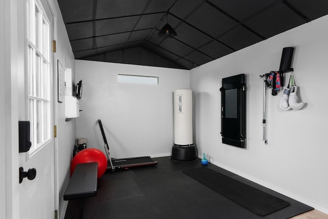 workout room featuring vaulted ceiling