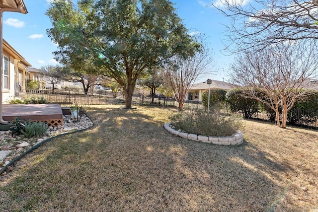 view of yard featuring a wooden deck