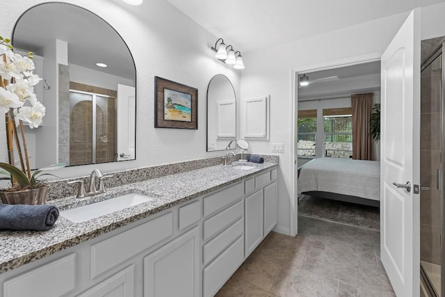 bathroom featuring vanity and a shower with shower door