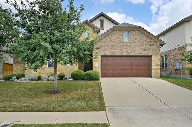 view of front facade featuring a garage and a front yard