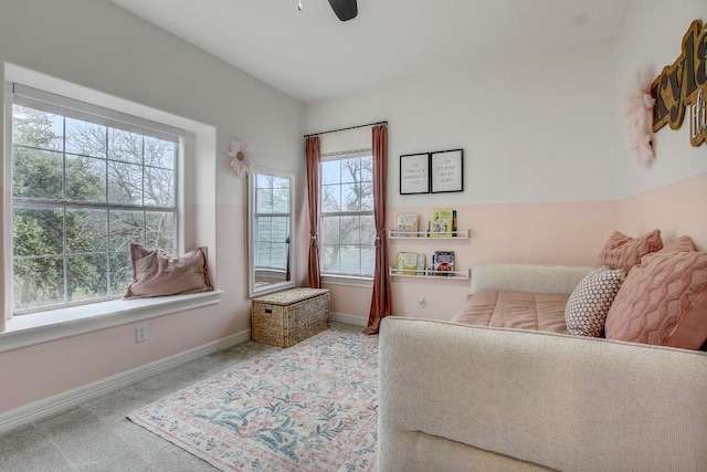 sitting room featuring light carpet and ceiling fan