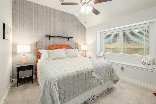 carpeted bedroom with lofted ceiling and ceiling fan