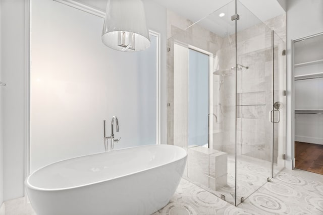 bathroom with shower with separate bathtub