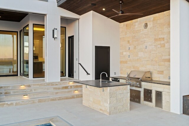 1409 Apache Tears, Horseshoe Bay, TX 78657 - view of patio with area for grilling and ceiling fan
