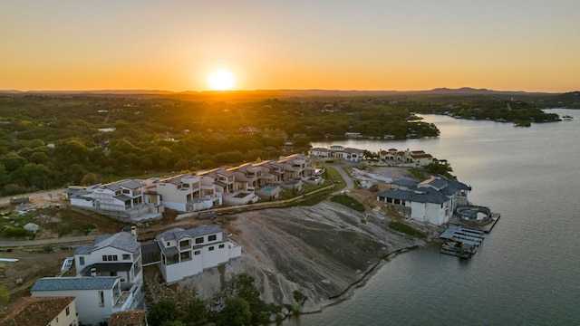 aerial view at dusk with a water view