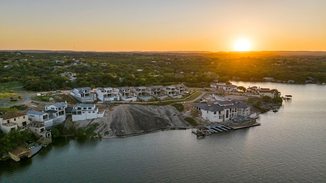 aerial view at dusk with a water view