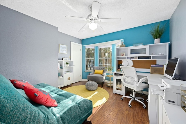 office area with hardwood / wood-style floors, a textured ceiling, and ceiling fan