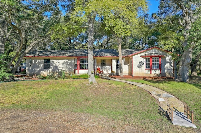 ranch-style house with a front lawn