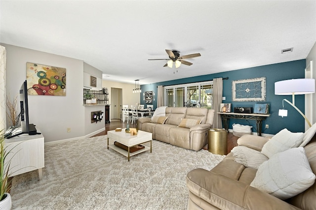 living room with carpet floors and ceiling fan