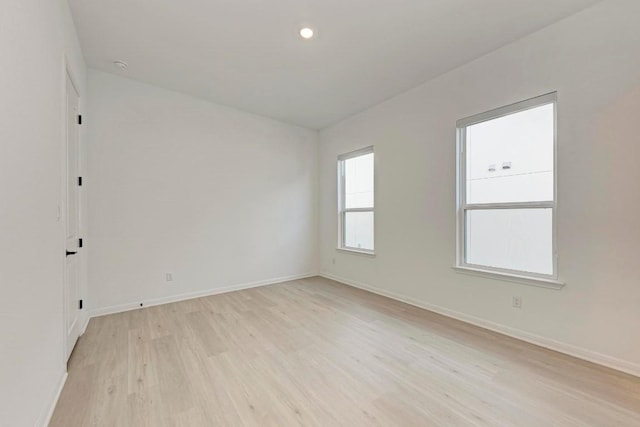 unfurnished room featuring light wood-type flooring