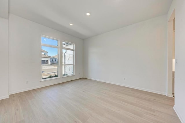 spare room with light hardwood / wood-style floors