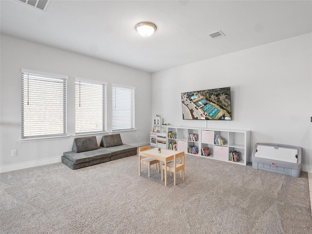 playroom featuring carpet floors, visible vents, and baseboards