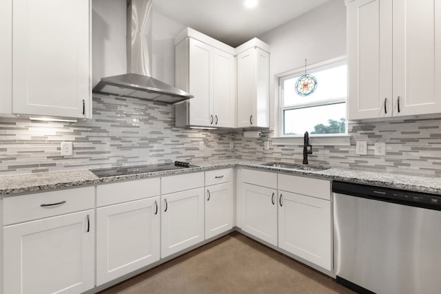 kitchen with sink, white cabinetry, black electric stovetop, stainless steel dishwasher, and wall chimney exhaust hood