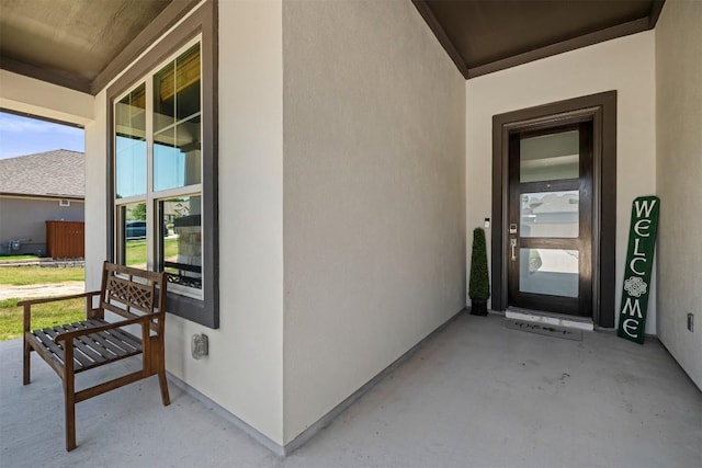 view of exterior entry featuring a porch