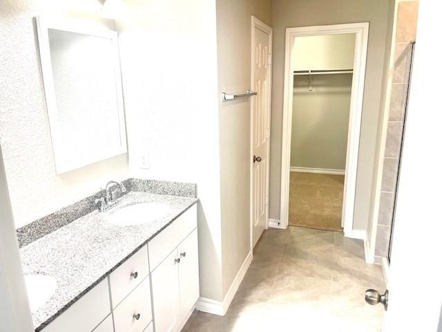 bathroom with vanity and tile patterned flooring