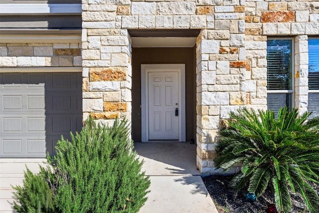 property entrance with a garage