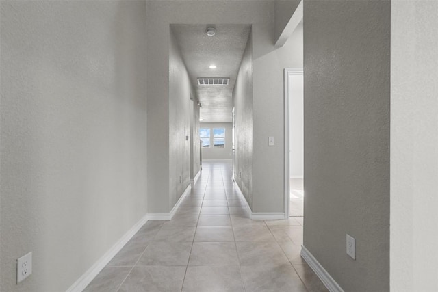 hallway with light tile patterned floors