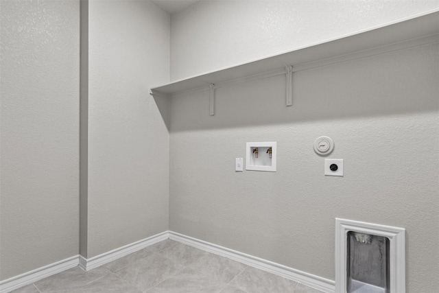 washroom featuring gas dryer hookup, washer hookup, hookup for an electric dryer, and light tile patterned flooring