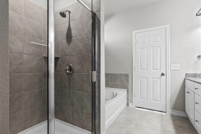 bathroom with vanity, tile patterned floors, and independent shower and bath