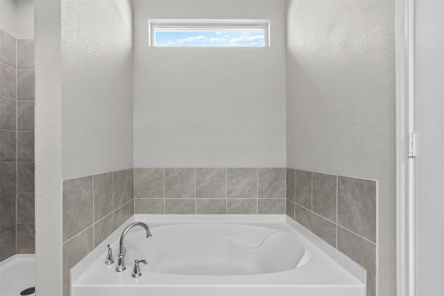 bathroom with separate shower and tub