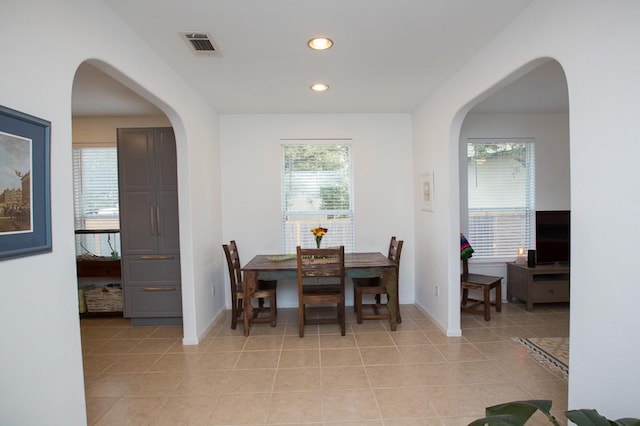 dining space featuring light tile patterned floors